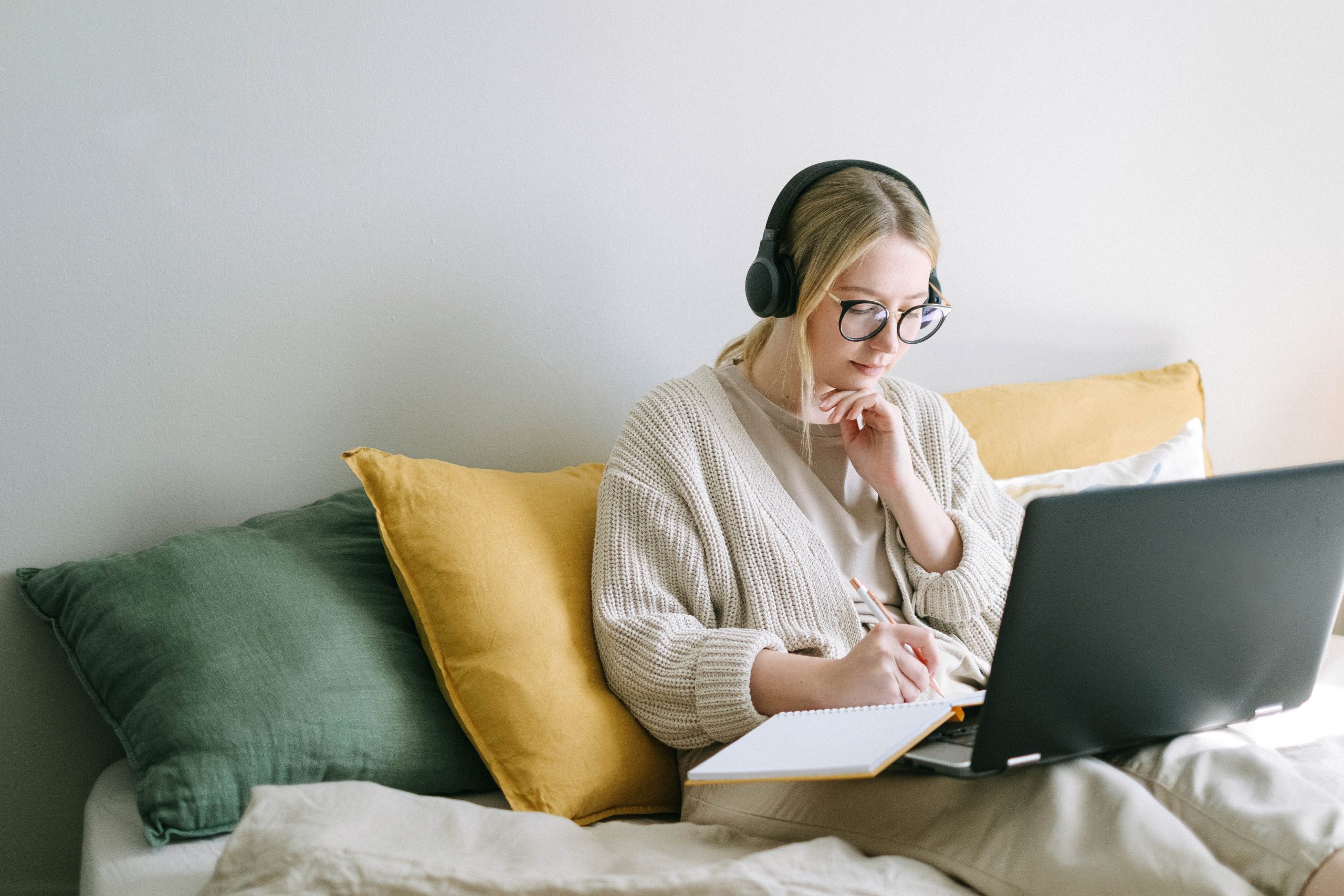 A freelancer working on the couch.